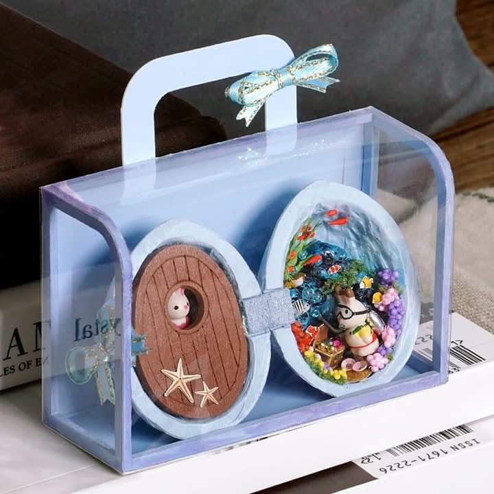 WALDWHISPER – Handmade dollhouse made from walnut shells with interior lighting